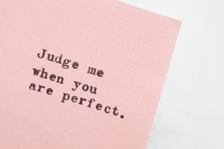 typed message on pink paper. What is perfectionism