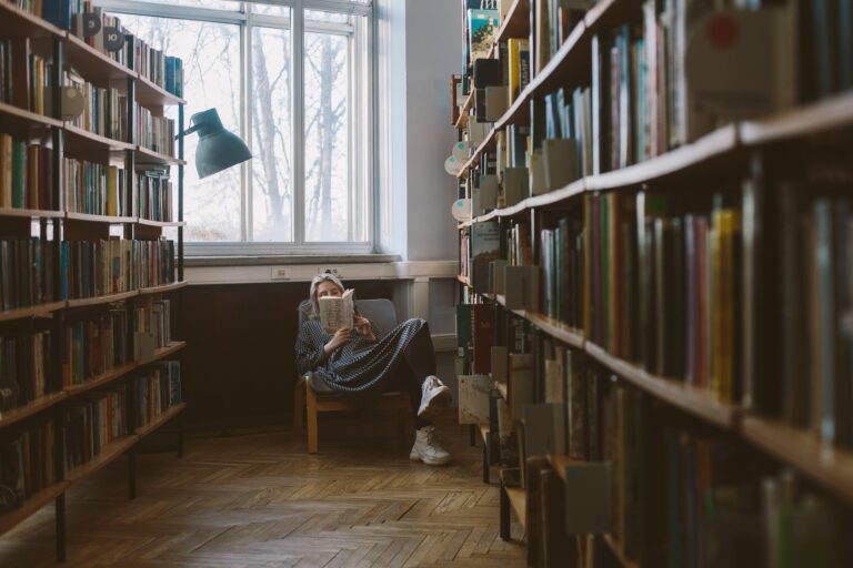 photo of woman reading book. Best books in July