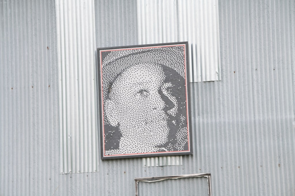 Picture of Emmett Till hanging on side of building. A Few Days Full of Trouble book review.