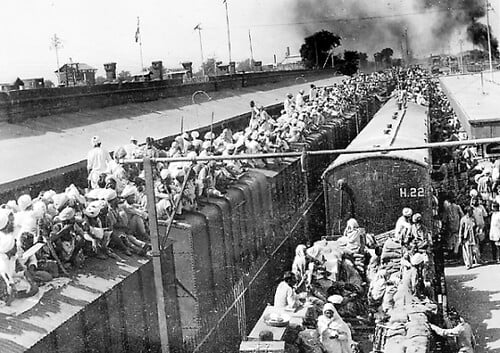 A picture taken in October, 1947 shows wagons packed with Muslim refugees fleeing to Pakistan by train in the border city of Amritsar, at the start of the first India-Pakistan war during the partition as we look at a number of books on the subject.