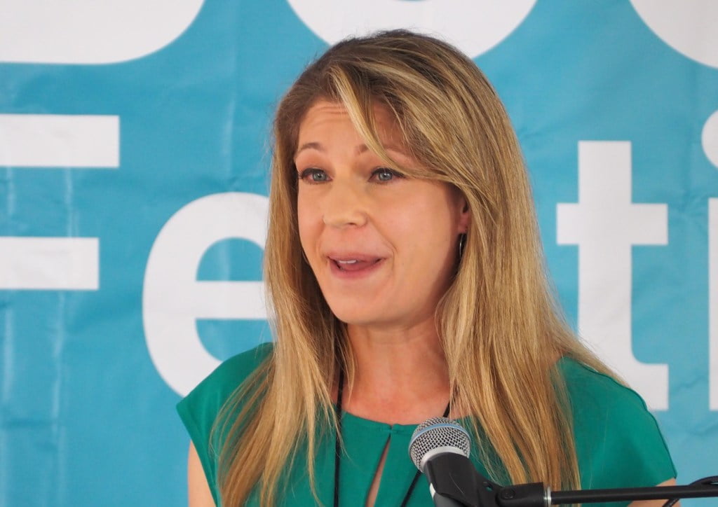 The Teachers author Alexandra Robbins speaks at festival in a green dress