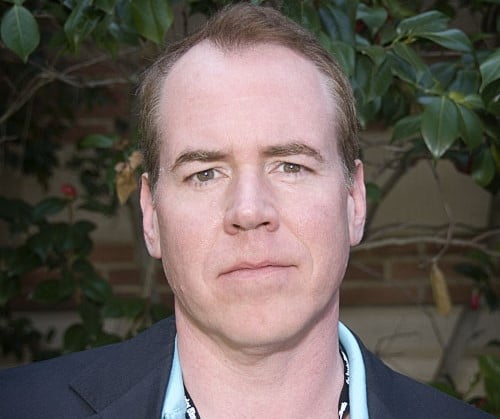 Bret Easton Ellis in a blue blazer is famous for autofiction