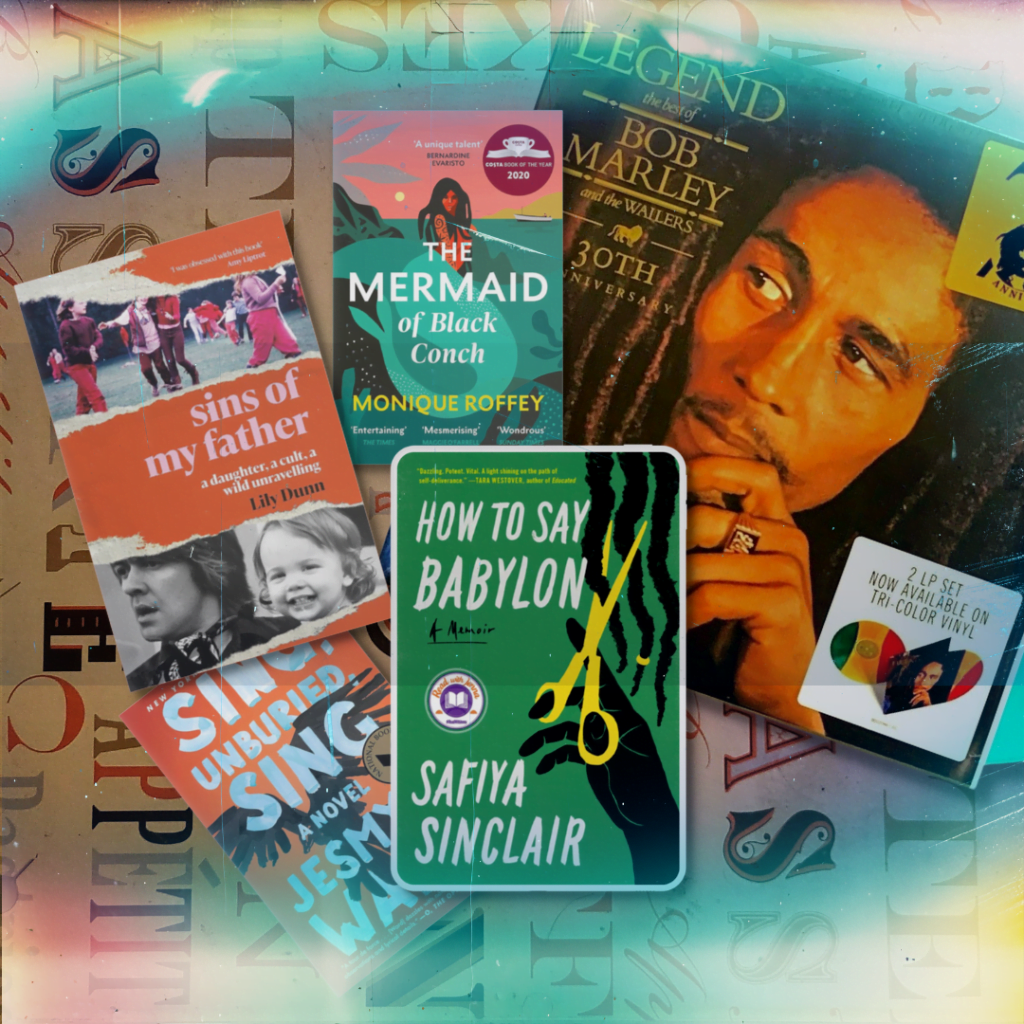 "How To Say Babylon: A Memoir" by Safiya Sinclair on top of table with books, "Sins of My Father" by Lily Dunn, "Sing Unburied Sing" by Jesmyn Ward, "The Mermaid of Black Conch", and "Legend: The Best of Bob Marley" vinyl.