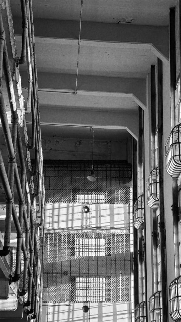 San Francisco literary tour. Black and white image of Alcatraz prison from the inside.