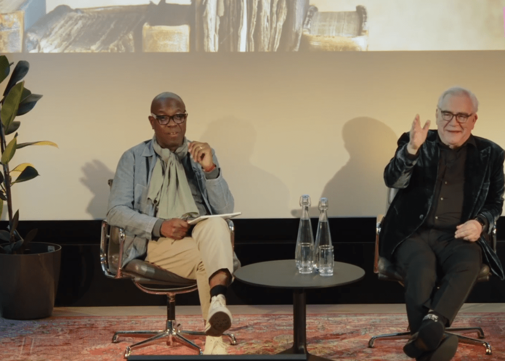 Image of Clive Myrie and Brian Cox at HistFest 2024, with Cox gesturing during a discussion.