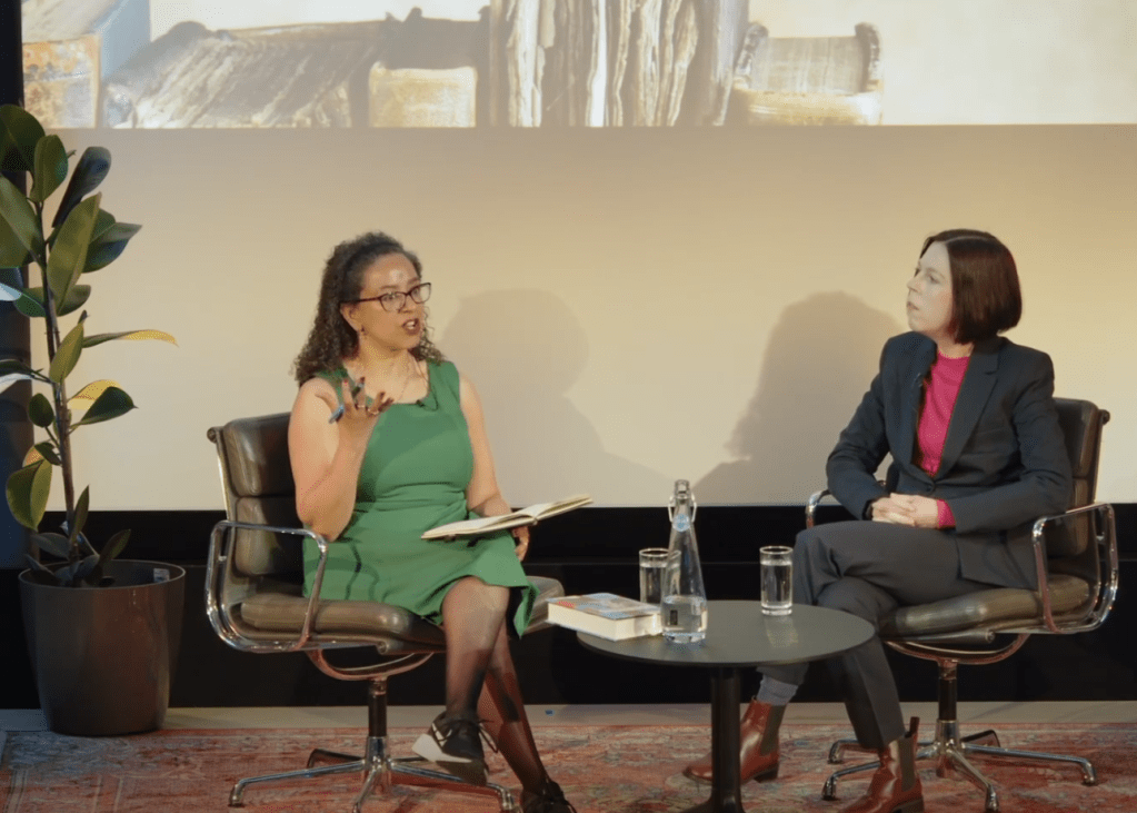 Wanda Wyporska and Hannah Durkin in conversation at HistFest 2024, seated against a backdrop with historic images.